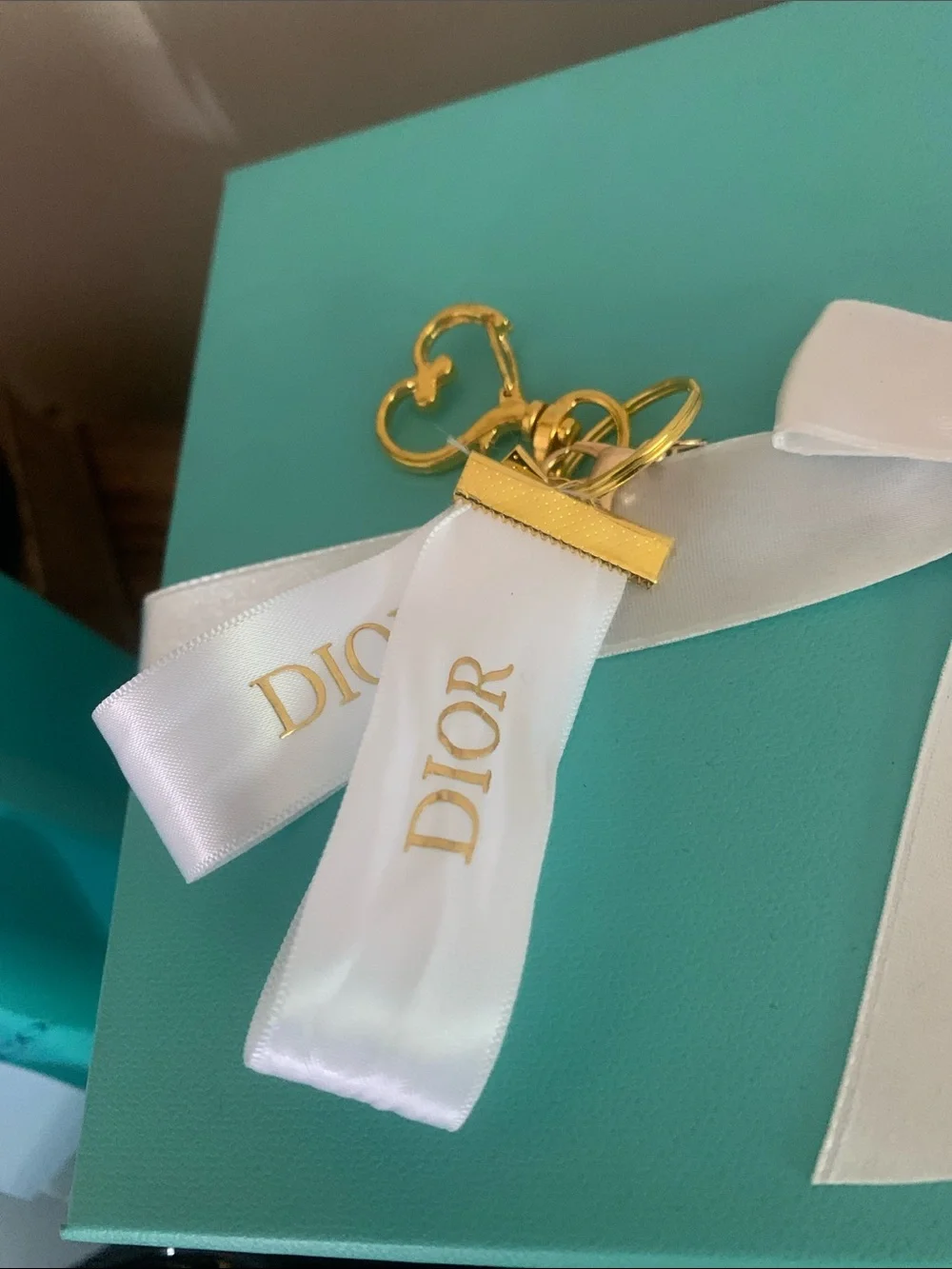 DIOR White Ribbon Key Ring with Gold & Green Clover Charm